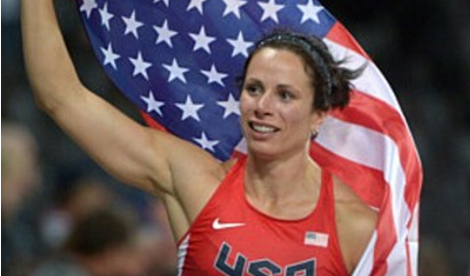 Jenn Suhr carries American flag over her