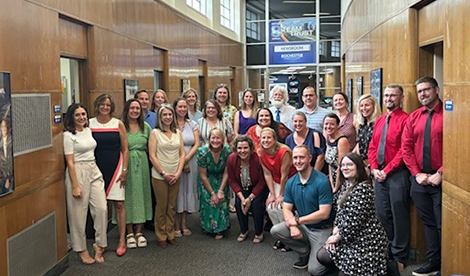 The scholarship winners smile in a large group