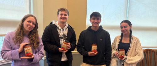 4 students smile with Guglielmo's Sauce