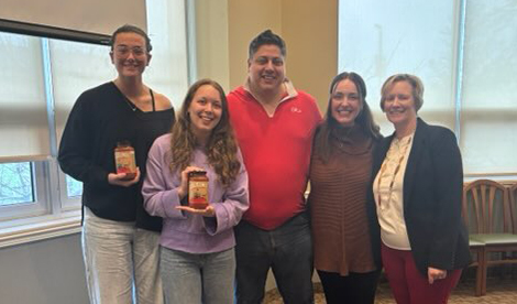 2 students smile with the Guglielmos and Donna McLaren