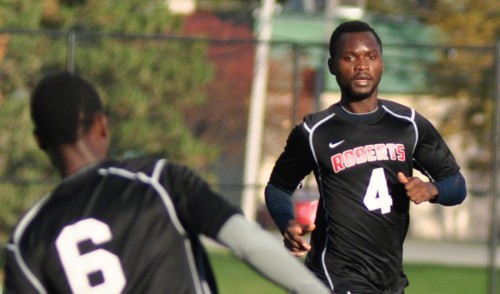 Kenny plays soccer wearing a black Roberts jersey
