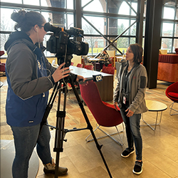 Lindsay Books, Director of Wellness, takes an interview from the Ch. 8 reporter.