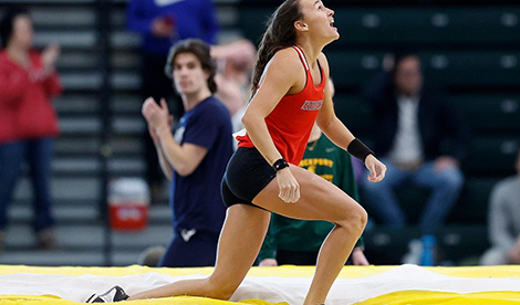 Brynn King celebrates after a successful pole vault jump.