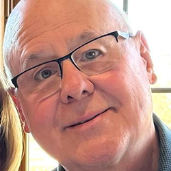 Timothy Wixom smiles