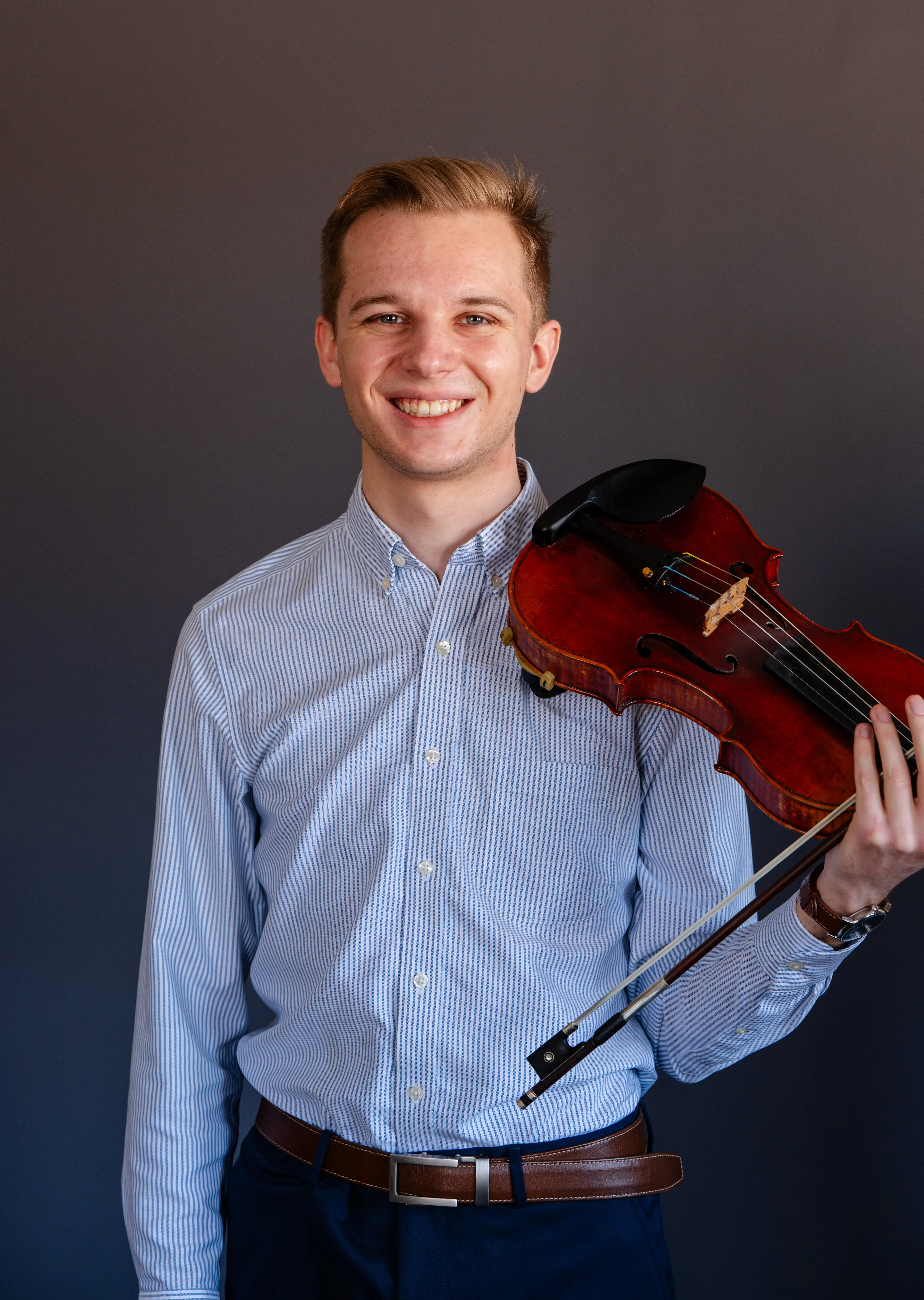 Joshua holds violin