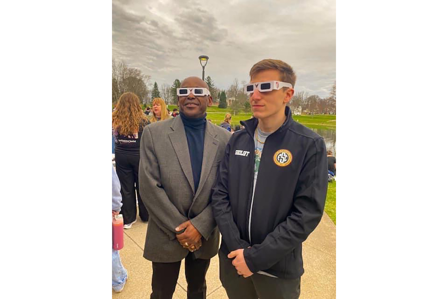 President Hayles and student Mikhail Sokoloff in eclipse glassess