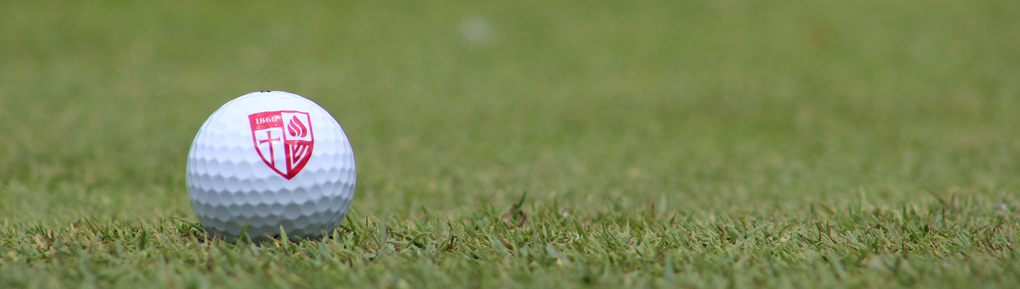Golf ball with Roberts logo on grass