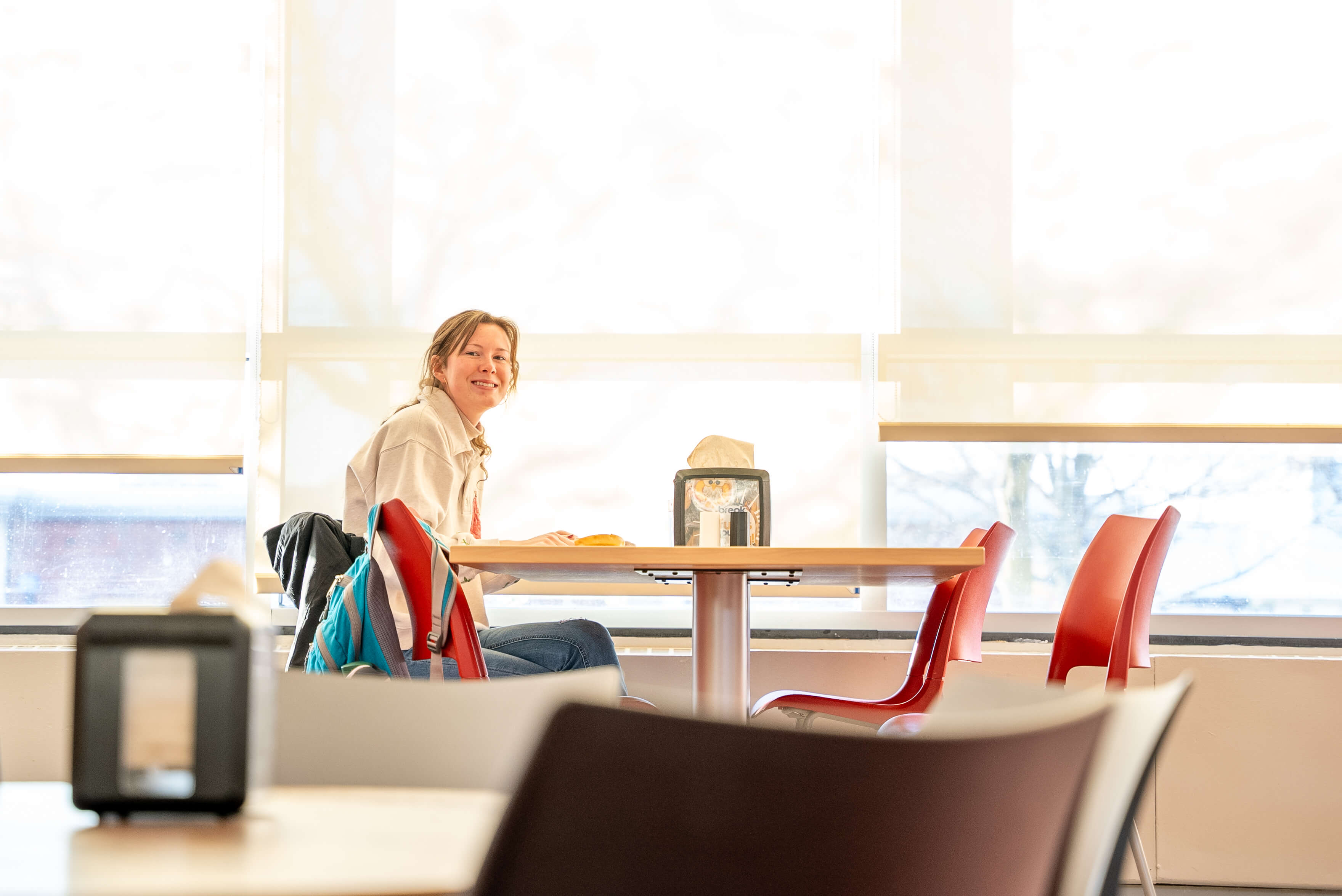 a student smiling at Roberts Wesleyan University