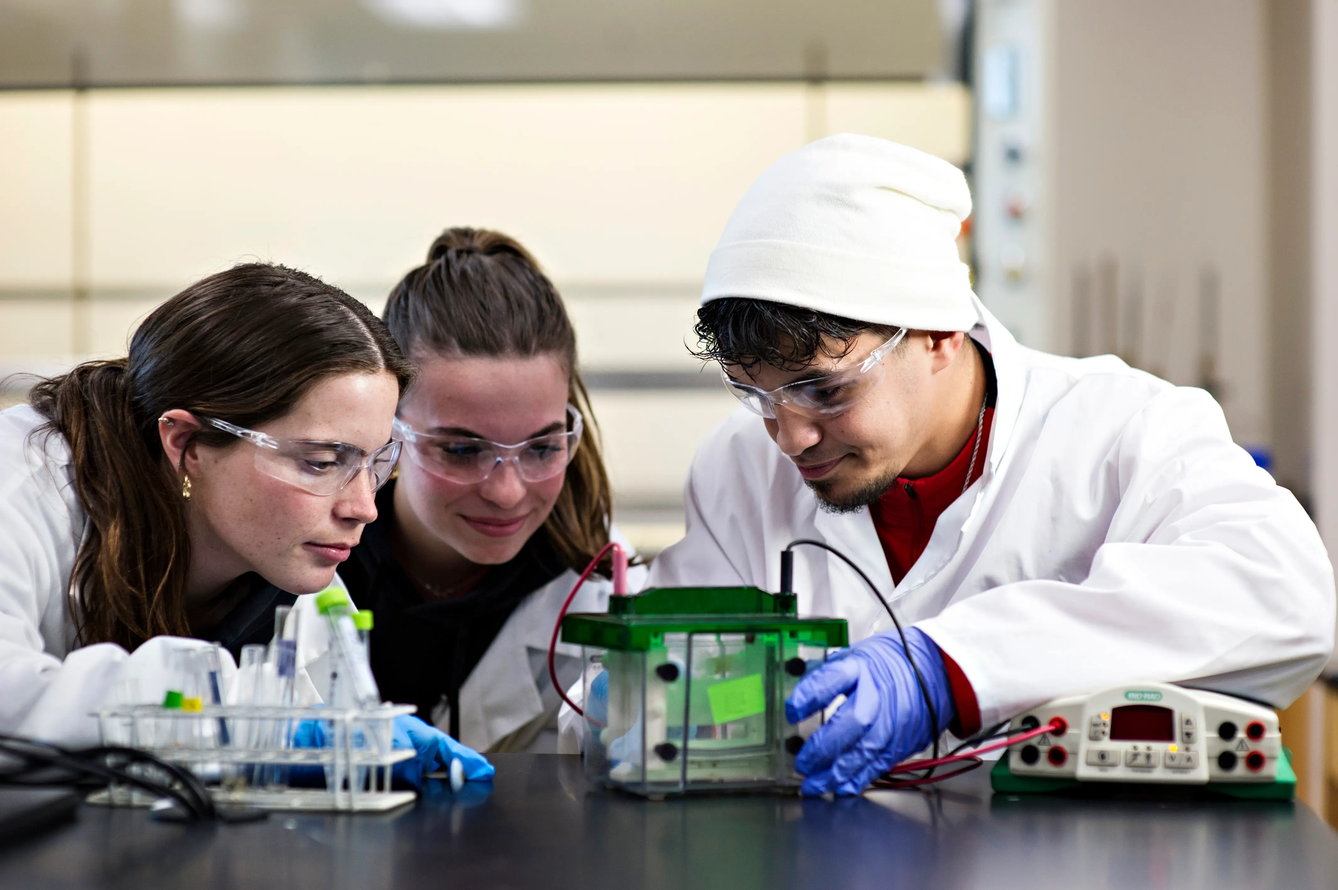 3 students looking at a test