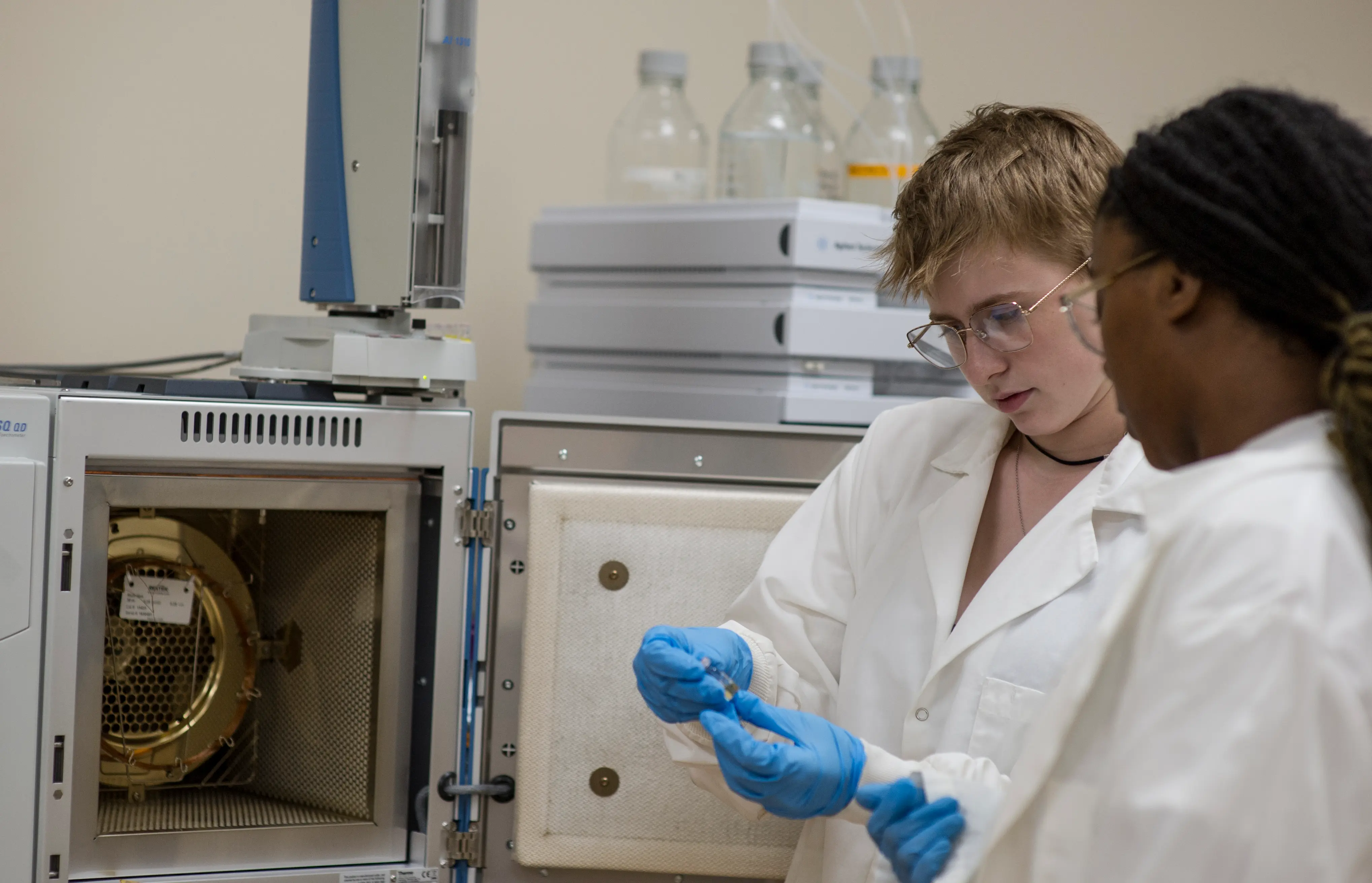 2 students with an instrument