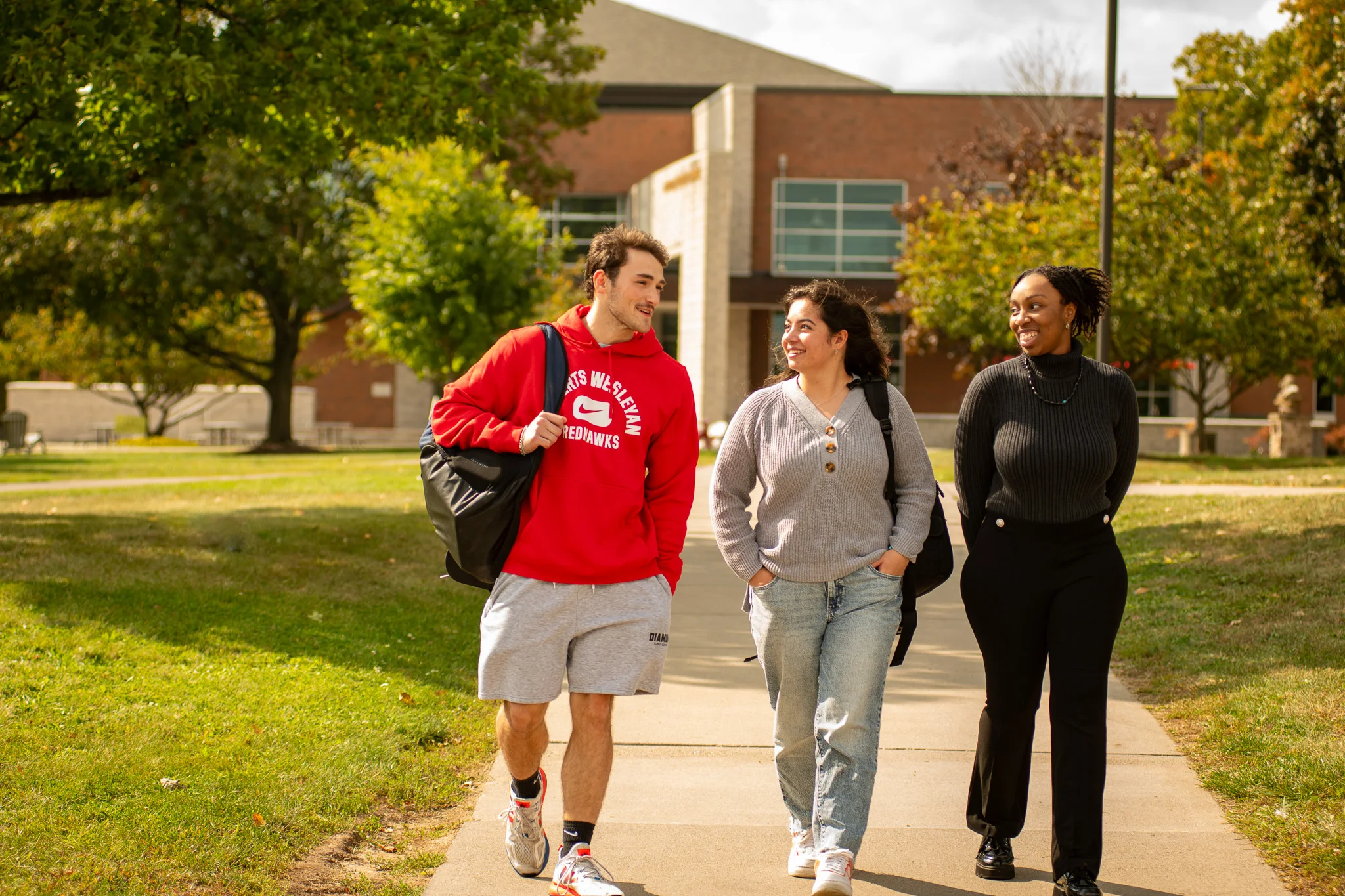 Three Students Walking in the Fall
