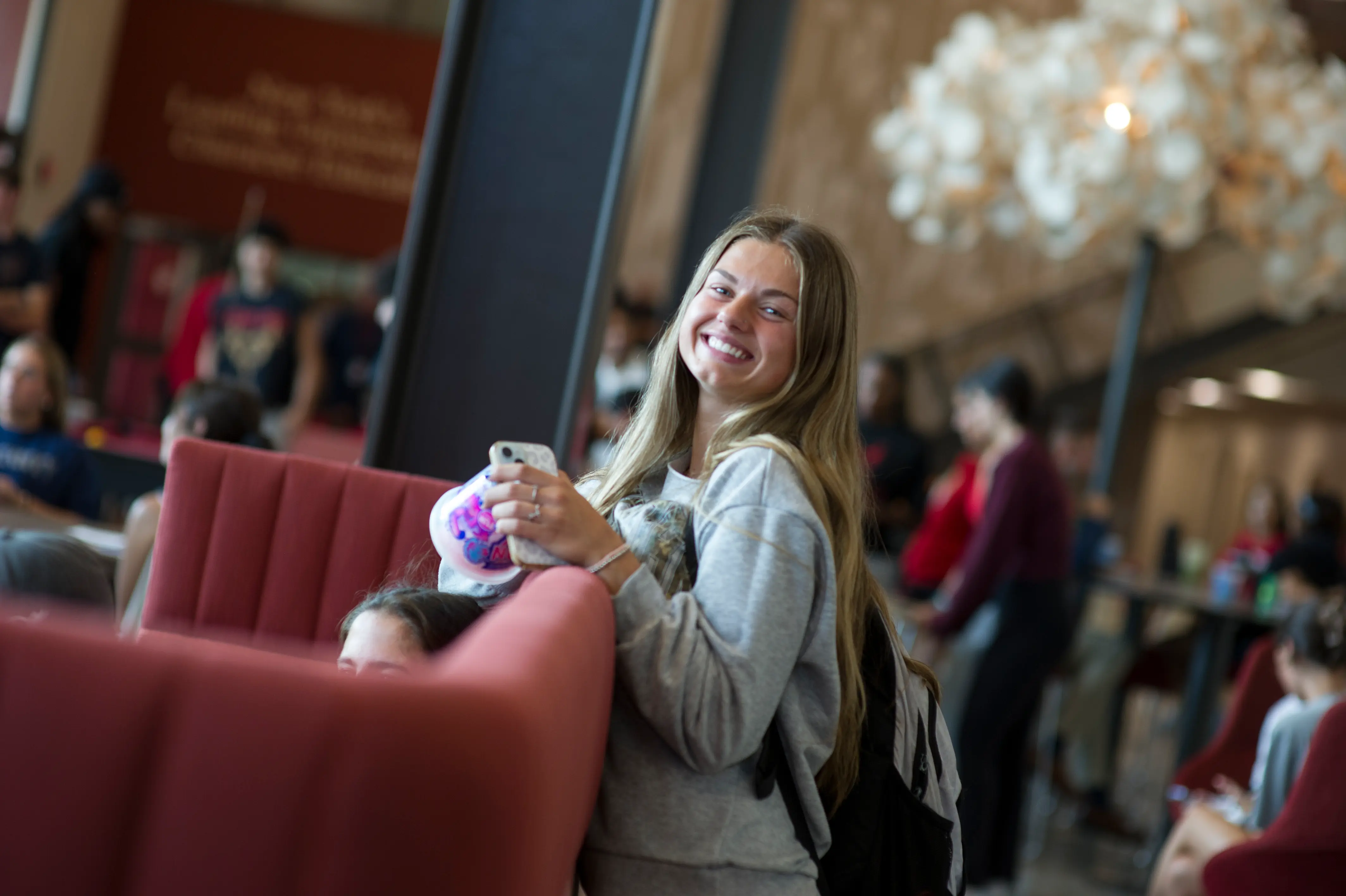 A young woman smiles in the GCEC