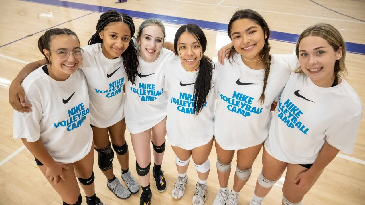 Girls smile at volleyball camp